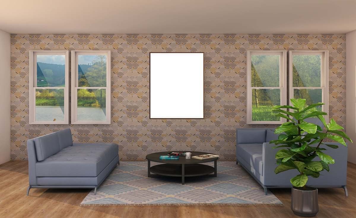 Pièce avec canapés, table basse, plante, tapis, fenêtres, tableau blanc